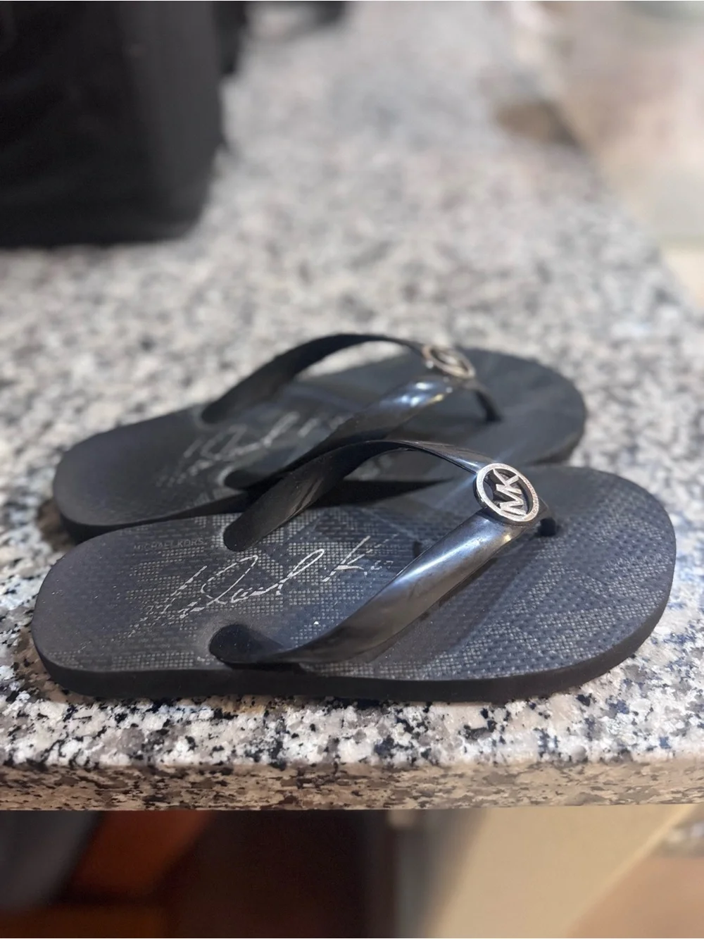 Michael Kors Black Jelly Flip Flops with Gold MK Medallion